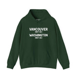 Vancouver Washington hoodie featuring text 'Vancouver (Not BC) Washington (Not DC)' in white on green fabric.