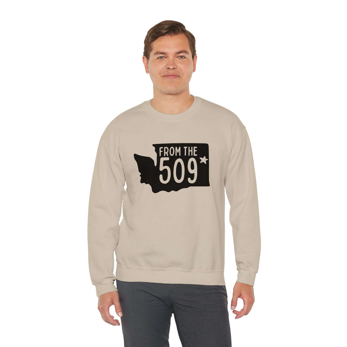 Man wearing a "From the 509" sweatshirt featuring Washington state silhouette with Spokane star.