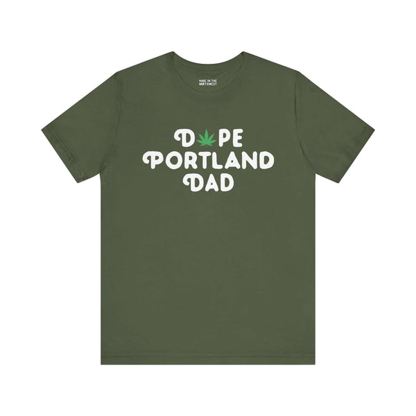 Green "Dope Portland Dad" soft tee with marijuana leaf replacing the 'O', celebrating laid-back, vibrant fatherhood in Portland style.