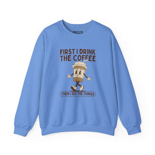 Blue sweatshirt with coffee cup graphic and text 'First I Drink the Coffee Then I Do the Things'.