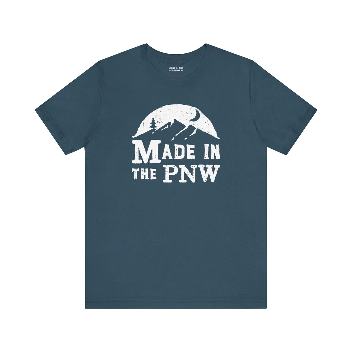 Made in the PNW T Shirt – Distressed Mountain Graphic Tee on a blue background with a white graphic design.