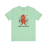 I Brake for Bigfoot soft tee featuring a whimsical Sasquatch graphic on mint green fabric.