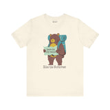 Kid's t-shirt with bear graphic, backpack, and map, featuring the text 