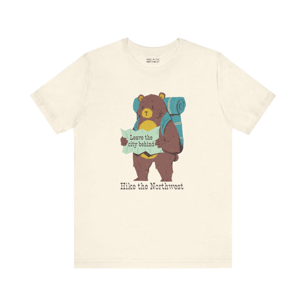 Kid's t-shirt with bear graphic, backpack, and map, featuring the text "Hike the Northwest" for outdoor adventure lovers.