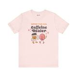 Support Your Local Caffeine Dealer coffee soft tee with playful graphic of a cup and donut, celebrating local coffee shops.