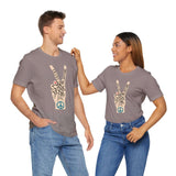 Couple wearing Power in Peace Premium Soft Tee with peace sign and uplifting words of love and unity.