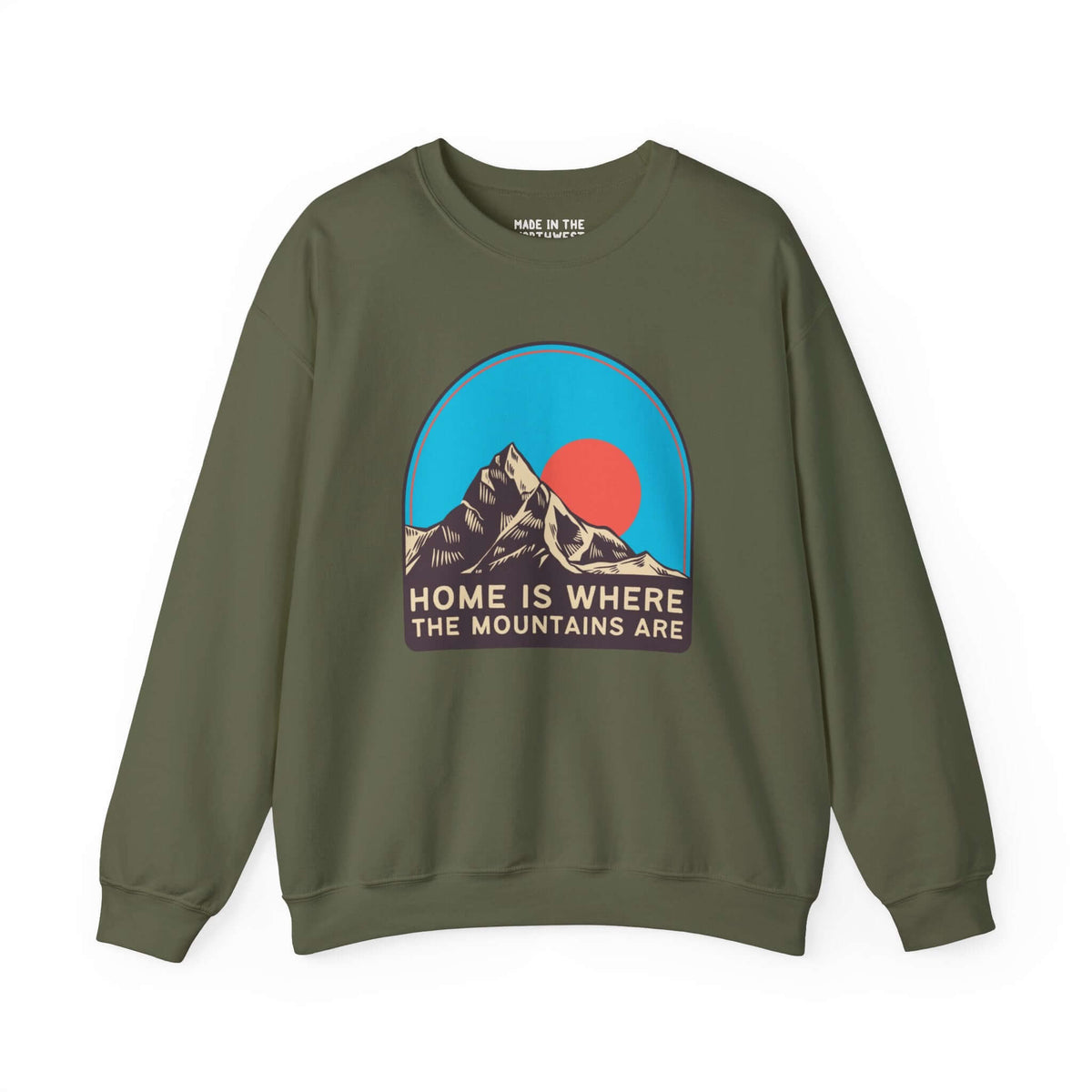 Green sweatshirt with "Home is Where the Mountains Are" graphic featuring bold mountains and sky design for nature lovers.