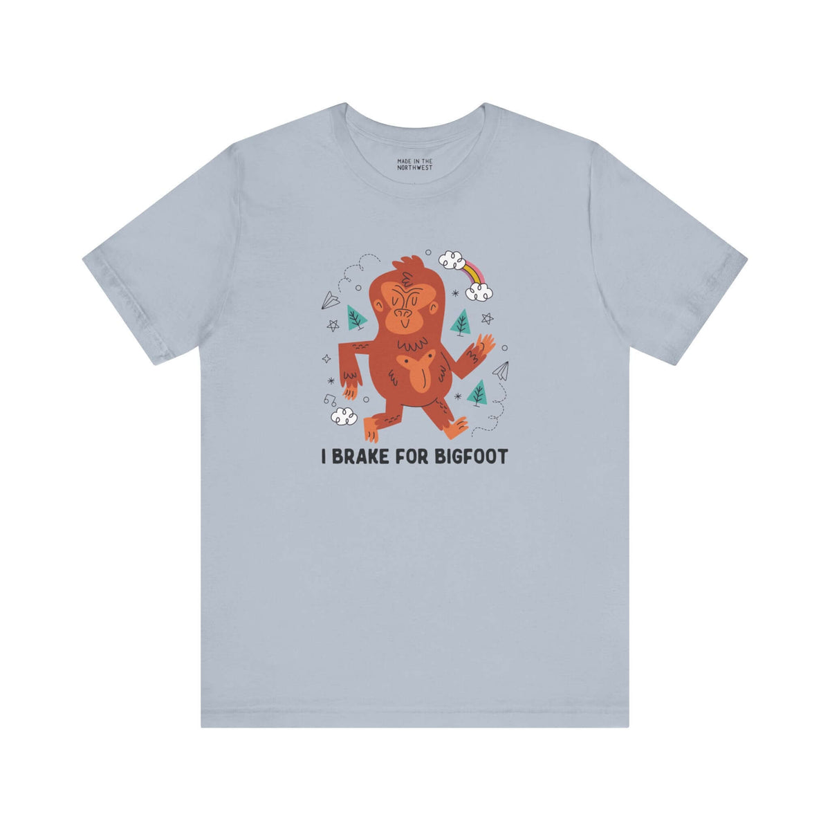 I Brake for Bigfoot Soft Tee Show your playful side and love for local folklore with our "I Brake for Bigfoot" Sasquatch Tee. This fun design features the phrase "I Brake for Bigfoot" alongside a whimsical graphic of a Sasquatch, perfect for those who enj