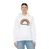 Model wearing a white hoodie featuring a retro rainbow design and 'Vancouver Pride' text.