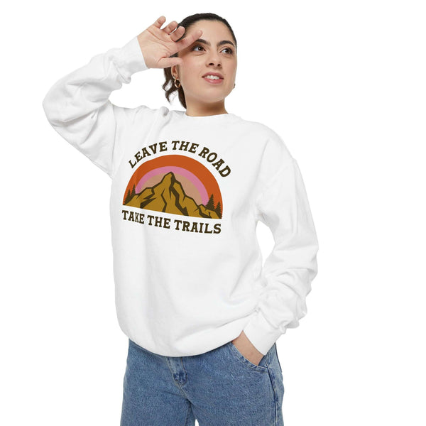 Model wearing Leave the Road Take the Trails Sweatshirt with mountain-inspired design, perfect for outdoor enthusiasts.