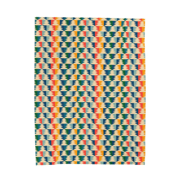 Apres Evergreen in the PNW Retro Lightweight Cozy Blanket with colorful retro geometric pattern.