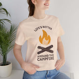 Woman wearing a Life's Better Around the Campfire T Shirt with a campfire design, ideal for outdoor lovers.