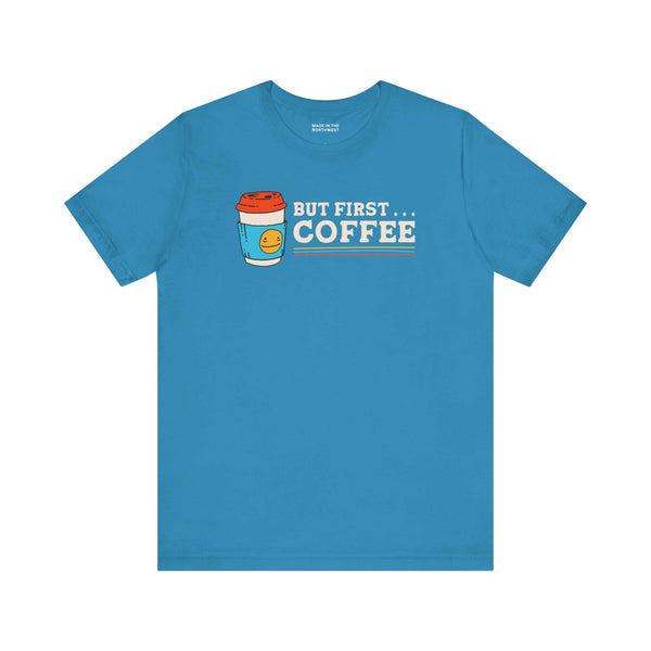 But First Coffee T Shirt featuring a vibrant blue color with a coffee cup graphic and playful text.