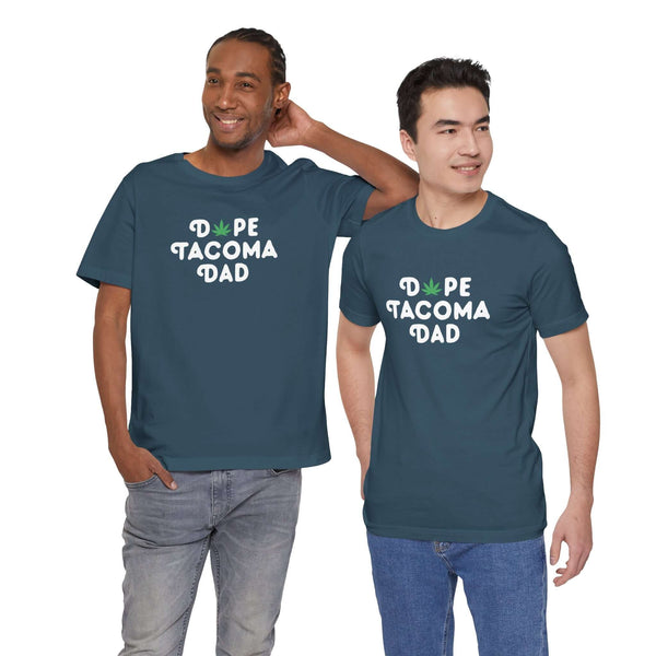 Two men wearing Dope Tacoma Dad soft tees with playful marijuana leaf design, showcasing local pride and style.