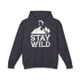 Stay Wild hoodie featuring mountains and trees graphic on a black sweatshirt.