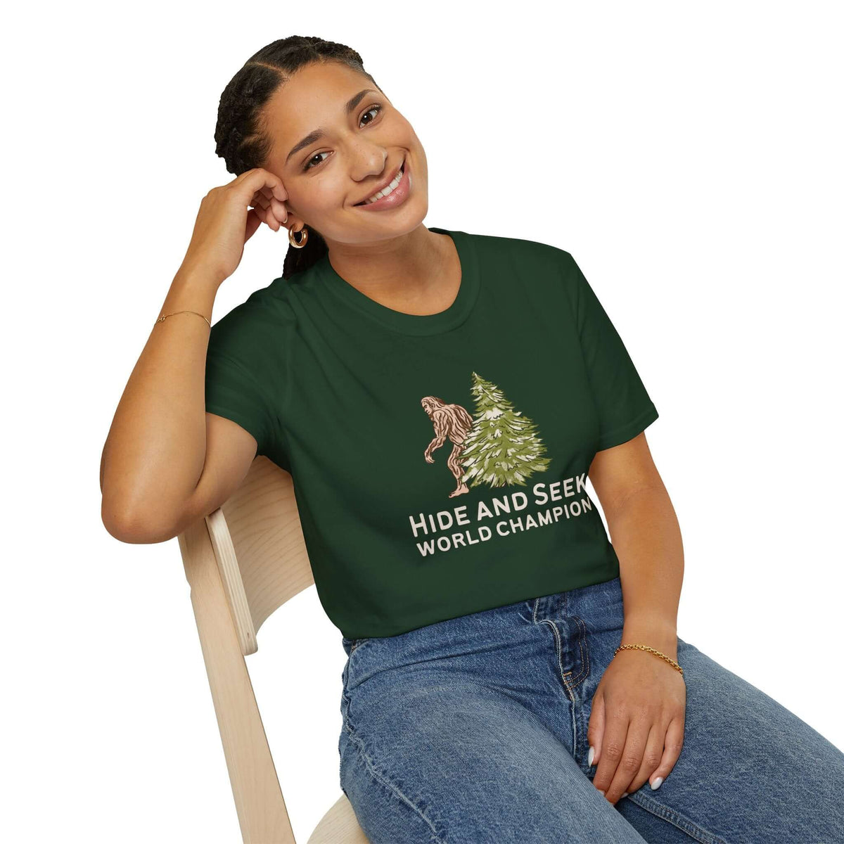 Woman wearing Hide and Seek World Champion Bigfoot T-Shirt, featuring Bigfoot hiding behind a tree.