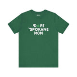 Green premium soft tee featuring 'Dope Spokane Mom' design with a marijuana leaf logo.