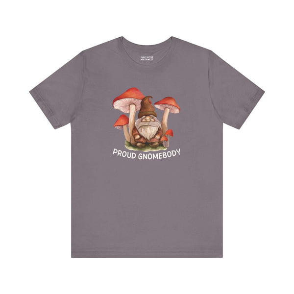 Premium soft tee featuring a gnome surrounded by mushrooms with the text 'Proud Gnomebody' for cozy homebodies.