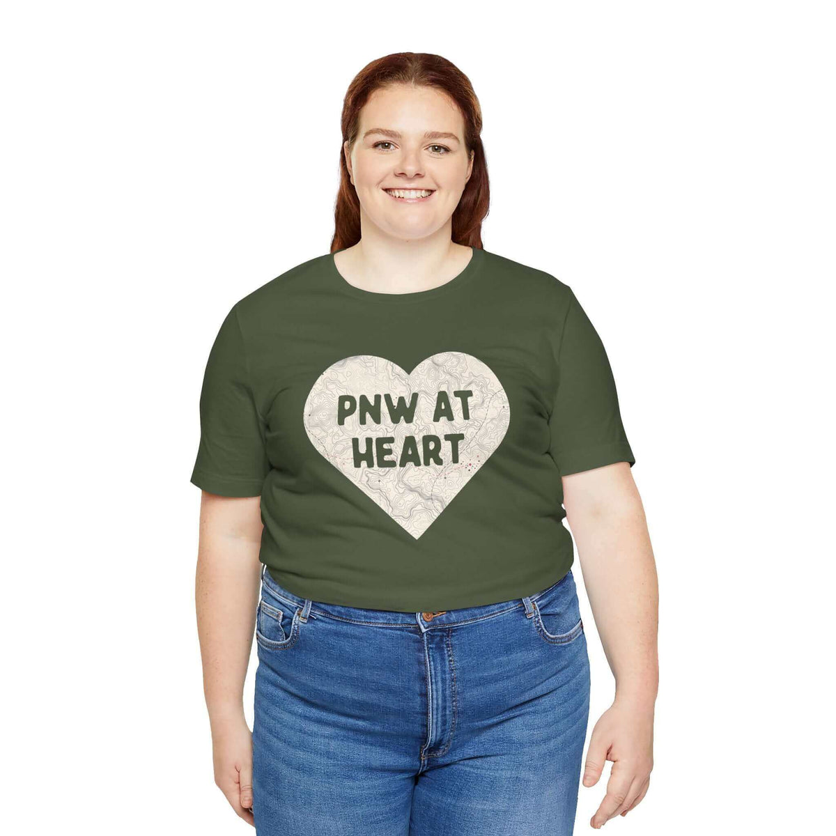 Person wearing "PNW at Heart" map print soft tee in green, showcasing Pacific Northwest pride.