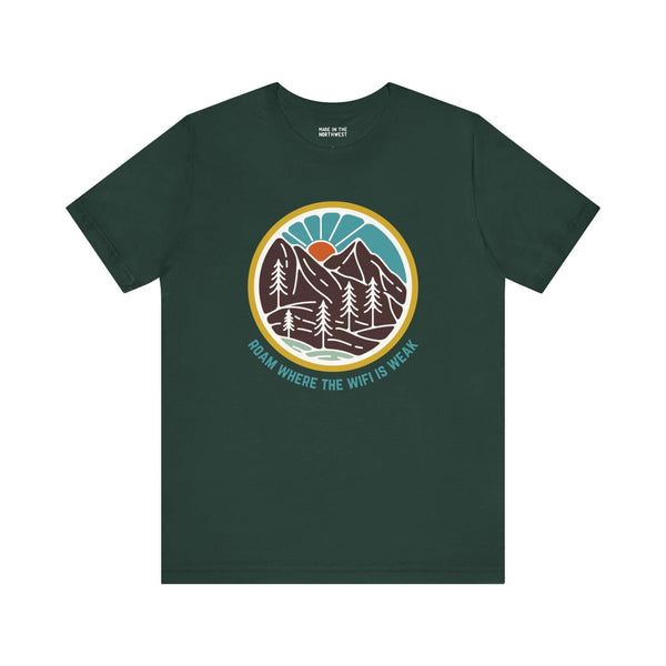 "Green tee with 'Roam Where the Wifi is Weak' text and colorful forest design, ideal for adventure and nature lovers."