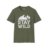 Stay Wild T Shirt featuring mountains and trees design on an olive green background.