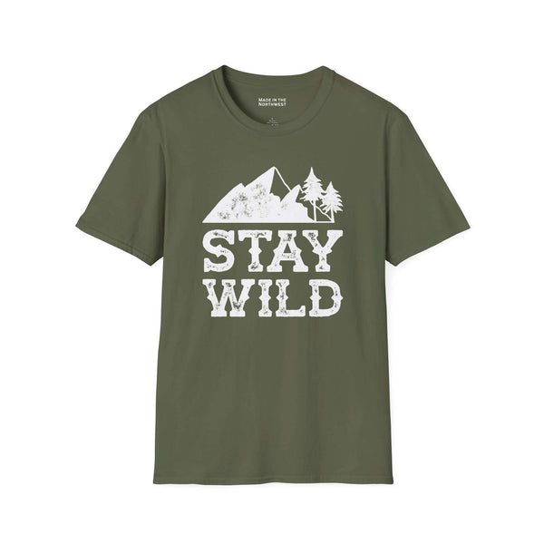 Stay Wild T Shirt featuring mountains and trees design on an olive green background.