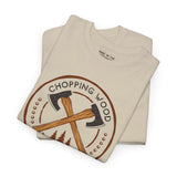 Chopping Wood Looks Good athletic tee featuring crossed axes graphic on a beige background.
