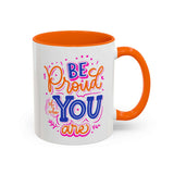 Be Proud of Who You Are mug with colorful lettering and orange interior for a confident start to your day.