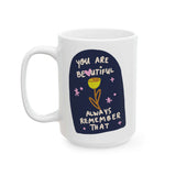 You Are Beautiful Always Remember That Mug with colorful print on glossy ceramic surface.