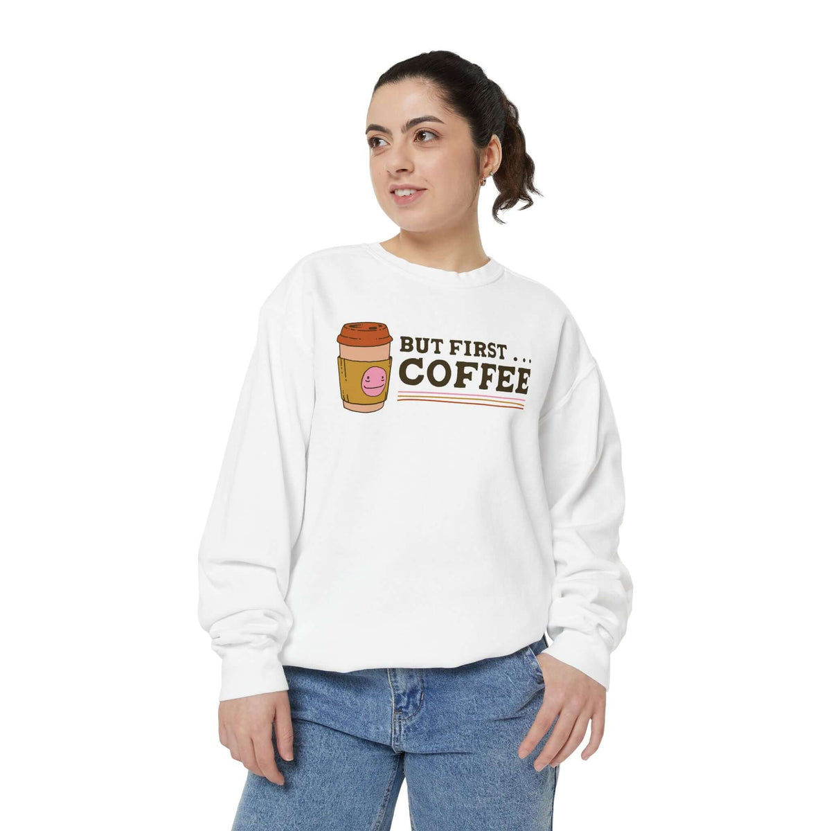 Model wearing a cozy 'But First Coffee' sweatshirt with a coffee cup graphic, perfect for relaxed mornings.