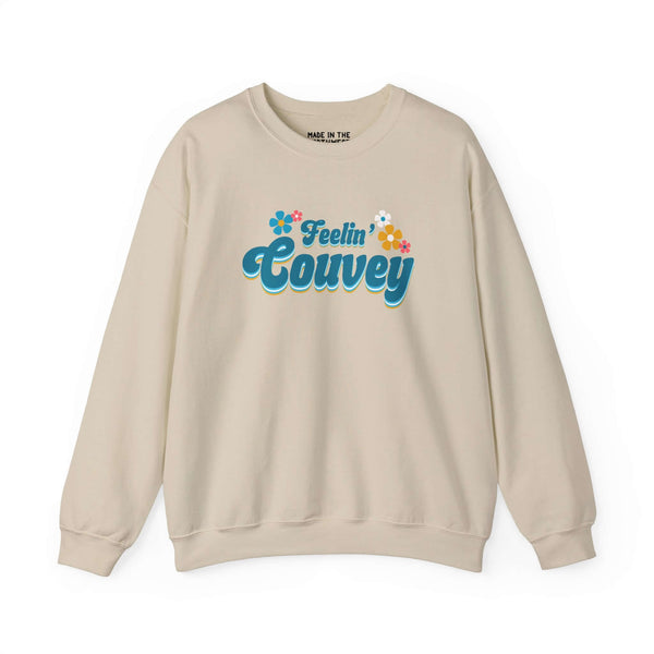Feelin' Couvey retro sweatshirt featuring colorful flower graphic, celebrating Vancouver's spirit in a stylish beige design.