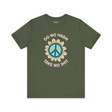 Do No Harm Take No Shit Tee featuring a peace flower design on a green t-shirt.