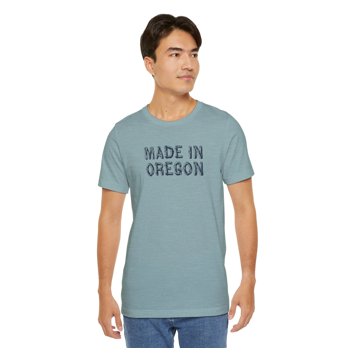 Man wearing a Made in Oregon log font premium soft tee, showcasing outdoor pride and Pacific Northwest heritage.