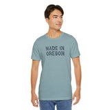 Man wearing a Made in Oregon log font premium soft tee, showcasing outdoor pride and Pacific Northwest heritage.