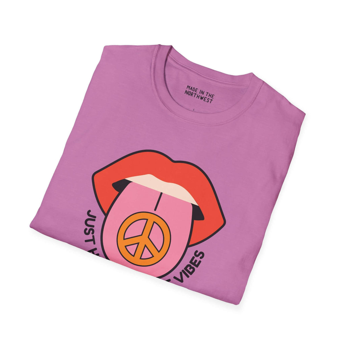 Light pink softstyle t-shirt featuring vibrant lips and peace sign, perfect for laid-back vibes and casual outings.