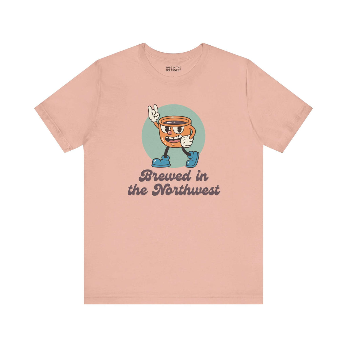 Brewed in the Northwest coffee tee featuring a cheerful coffee cup design on a soft pink shirt.