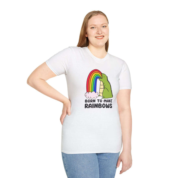 Born to Make Rainbows Dinosaur t-shirt featuring a colorful rainbow and playful design, worn by a smiling model.