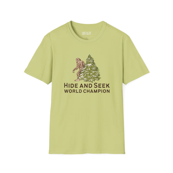 Bigfoot Hide and Seek World Champion t-shirt with green background and tree graphic.
