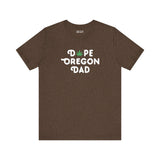 Dope Oregon Dad soft tee featuring playful marijuana leaf in 'O', perfect for laid-back, cool dads.