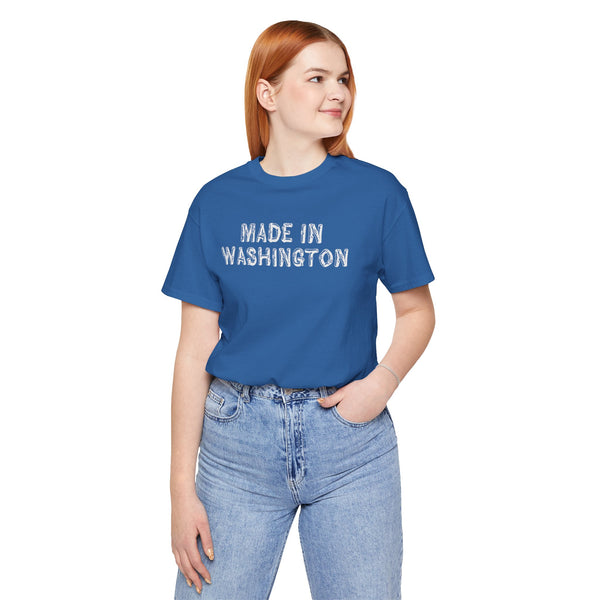 Woman wearing a blue tee with 'Made in Washington' text in wood log font, showcasing Pacific Northwest pride.