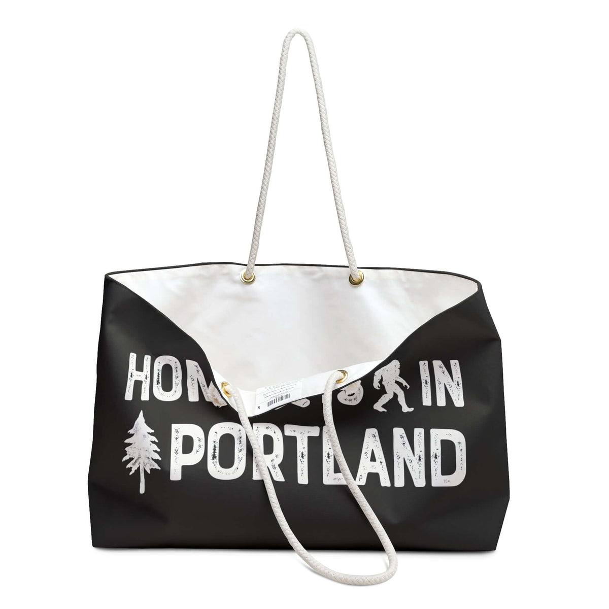 Home is in Portland Weekender Bag with rope handles and graphic design featuring trees and Bigfoot.
