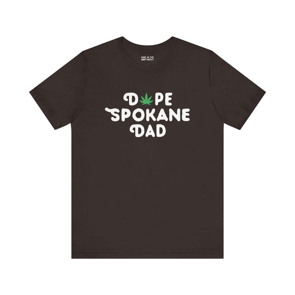 Black "Dope Spokane Dad" t-shirt with a playful marijuana leaf design, perfect for stylish dads in Washington state.