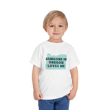 Someone in Oregon Loves Me Premium Soft Toddler Tee worn by a smiling child.