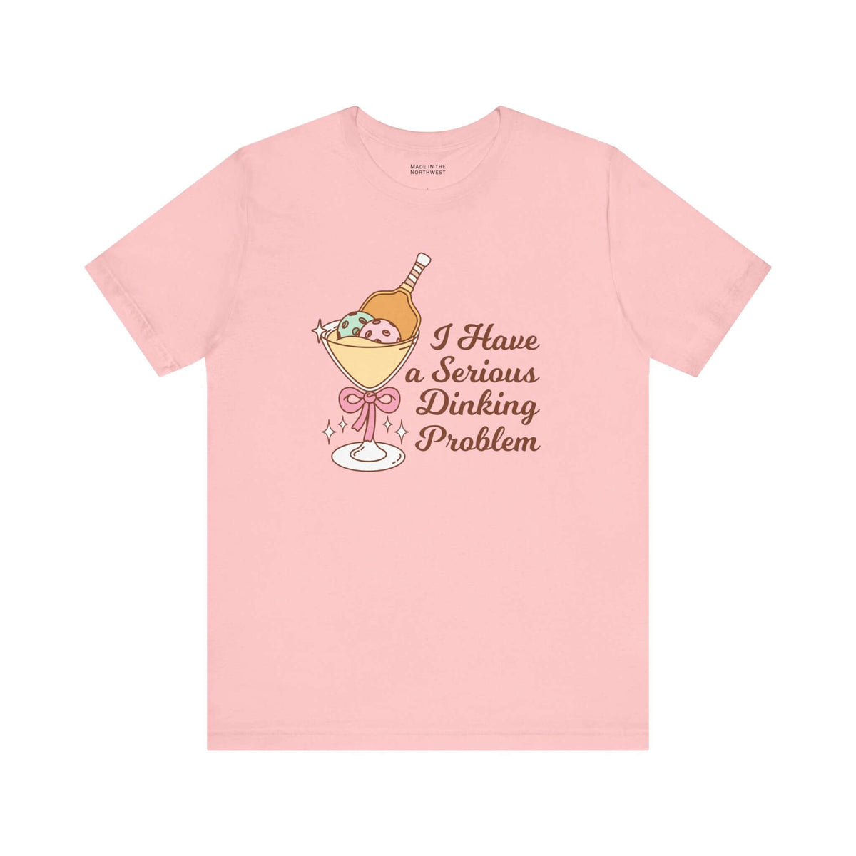 I Have a Serious Dinking Problem T Shirt featuring playful cocktail graphic on pink fabric.