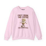 Light pink sweatshirt with the phrase 'First I Drink the Coffee Then I Do the Things' featuring a coffee cup graphic.