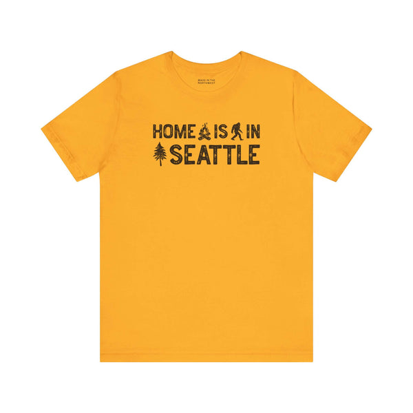 Home Is in Seattle Tee in vibrant yellow, showcasing Seattle pride with graphic elements like a campfire and evergreen.