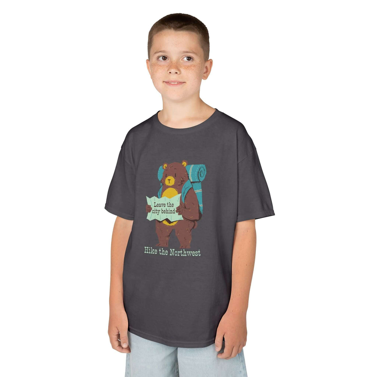 Child wearing Bear's Big Northwest Adventure tee featuring a bear with a backpack and map, perfect for outdoor explorers.