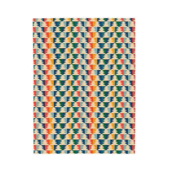 Apres Evergreen in the PNW Retro Lightweight Cozy Blanket featuring a colorful geometric pattern.