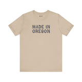 Premium soft tee with 'Made in Oregon' rustic log font, perfect for Pacific Northwest outdoor enthusiasts.