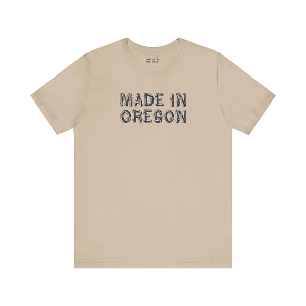Premium soft tee with 'Made in Oregon' rustic log font, perfect for Pacific Northwest outdoor enthusiasts.